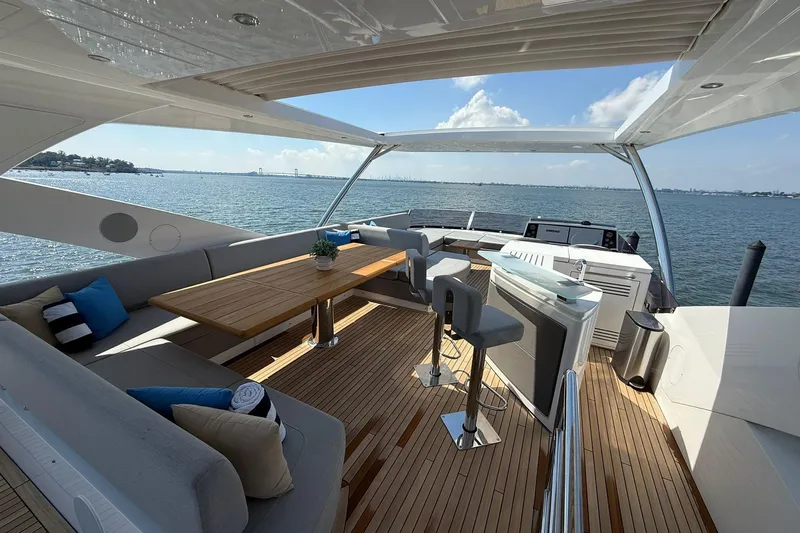  Yacht Photos Pics Luxurious 2021 Sunseeker 76 Yacht deck with elegant seating and ocean view.