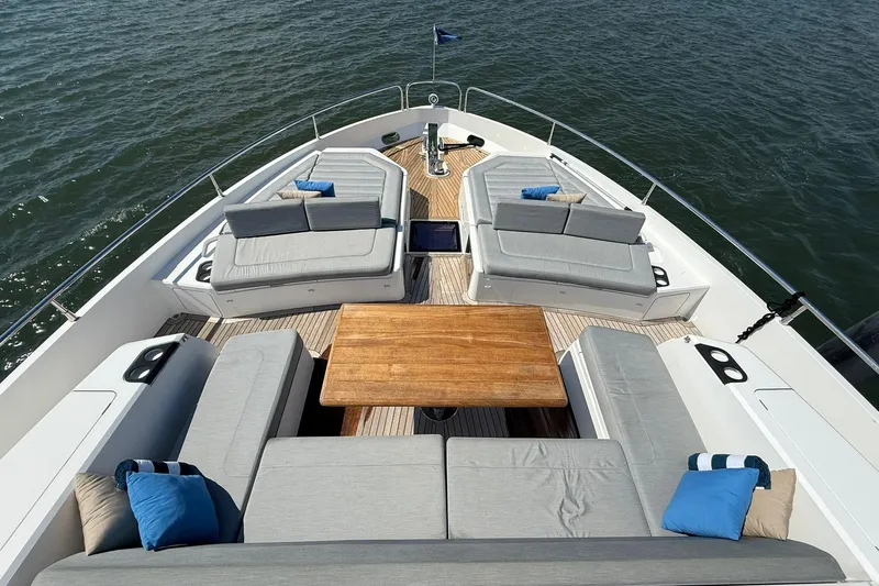  Yacht Photos Pics Luxurious 2021 Sunseeker 76 Yacht deck with elegant seating and wooden table.