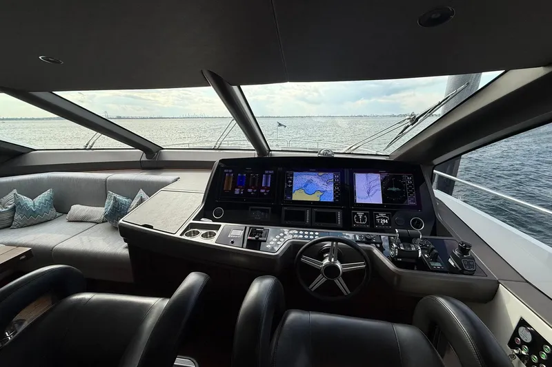  Yacht Photos Pics Luxurious 2021 Sunseeker 76 Yacht helm with advanced navigation systems and panoramic sea view.