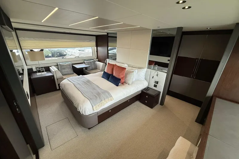  Yacht Photos Pics Luxurious bedroom interior of 2021 Sunseeker 76 Yacht with modern furnishings and elegant decor.