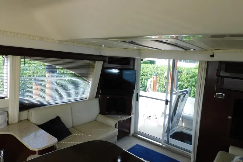 Full Deck Yacht Photos Pics Interior of 2008 Sea Ray 44 Sedan Bridge yacht with modern seating and outdoor view.