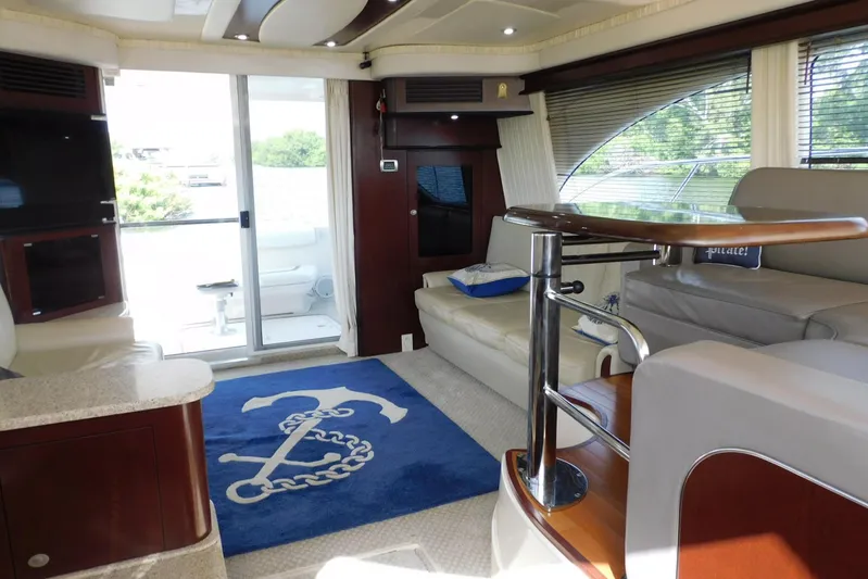 Full Deck Yacht Photos Pics Luxurious interior of 2008 Sea Ray 44 Sedan Bridge yacht with elegant seating and nautical decor.