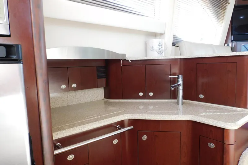 Full Deck Yacht Photos Pics Luxurious kitchen area in 2008 Sea Ray 44 Sedan Bridge yacht with modern fixtures.