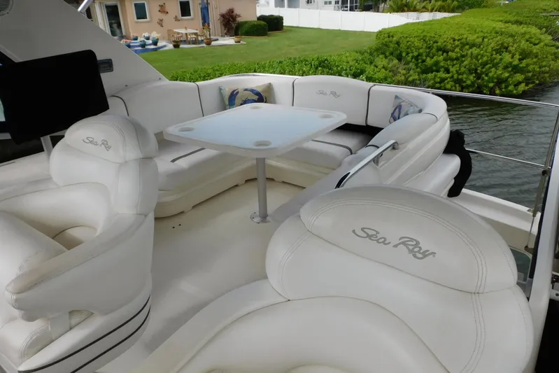 Full Deck Yacht Photos Pics Luxurious seating area on 2008 Sea Ray 44 Sedan Bridge yacht with white upholstery.