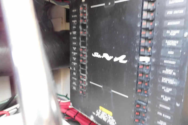 Full Deck Yacht Photos Pics Electrical panel of 2008 Sea Ray 44 Sedan Bridge yacht, featuring labeled switches and wiring.