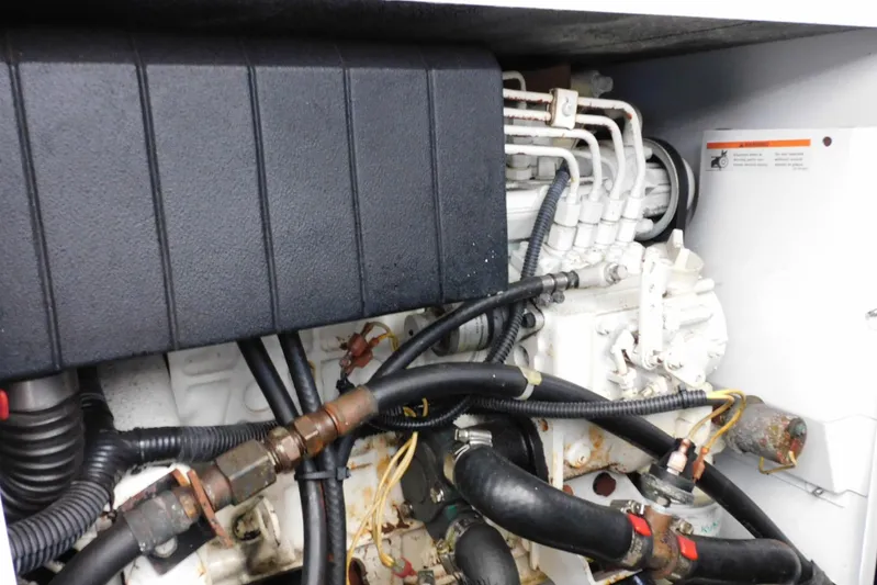 Full Deck Yacht Photos Pics Engine compartment of a 2008 Sea Ray 44 Sedan Bridge with visible hoses and components.