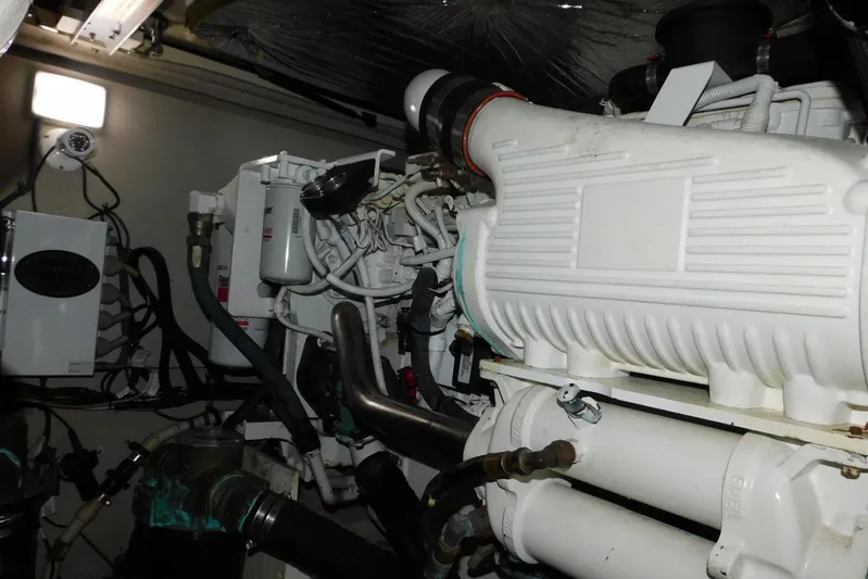 Full Deck Yacht Photos Pics Engine room of 2008 Sea Ray 44 Sedan Bridge, showcasing mechanical components and wiring.