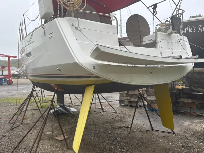 Statira Yacht Photos Pics 2017 Jeanneau Sun Odyssey 389 sailboat on stands, showcasing hull and rudder design.