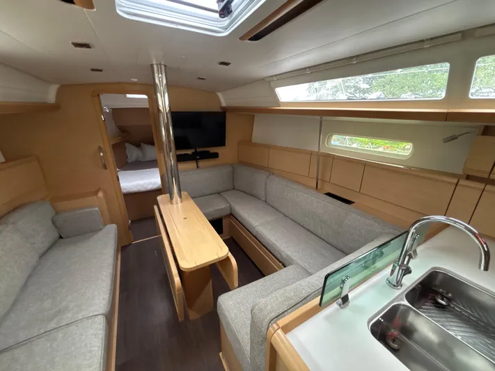 Statira Yacht Photos Pics Interior of 2017 Jeanneau Sun Odyssey 389 yacht with modern furnishings and ample seating.
