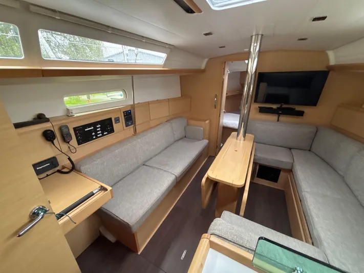 Statira Yacht Photos Pics Interior of 2017 Jeanneau Sun Odyssey 389 sailboat with modern furnishings and navigation equipment.