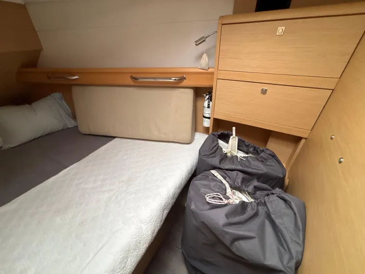 Statira Yacht Photos Pics Cozy cabin interior of 2017 Jeanneau Sun Odyssey 389 sailboat with storage and bedding.