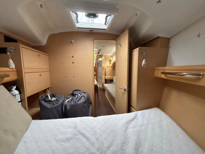 Statira Yacht Photos Pics Interior of 2017 Jeanneau Sun Odyssey 389 yacht, featuring cozy cabin and modern wood finish.