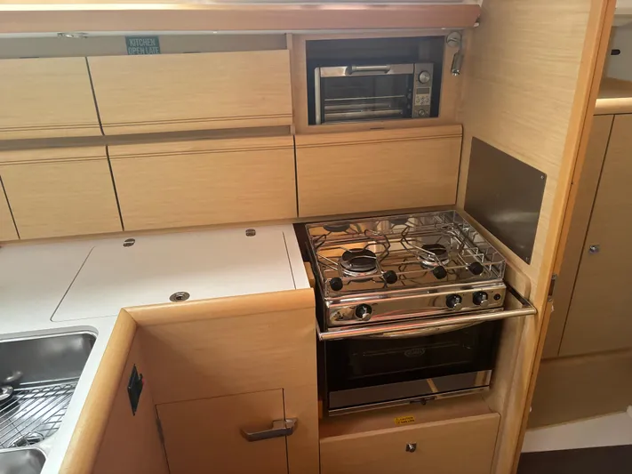 Statira Yacht Photos Pics Modern kitchen in 2017 Jeanneau Sun Odyssey 389 yacht with stove and oven.