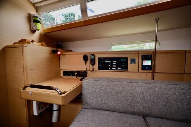 Statira Yacht Photos Pics Interior of 2017 Jeanneau Sun Odyssey 389 sailboat, featuring navigation station and control panel.