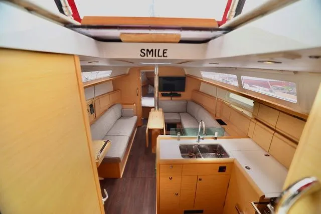 Statira Yacht Photos Pics Interior of 2017 Jeanneau Sun Odyssey 389 yacht, featuring modern kitchen and cozy seating area.