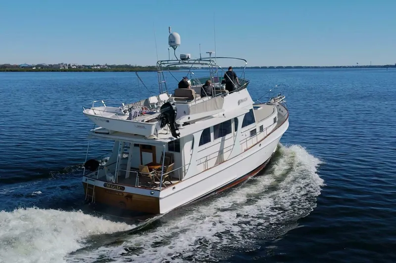 Magic Yacht Photos Pics Grand Banks 46 Europa 1996 yacht cruising on calm waters.