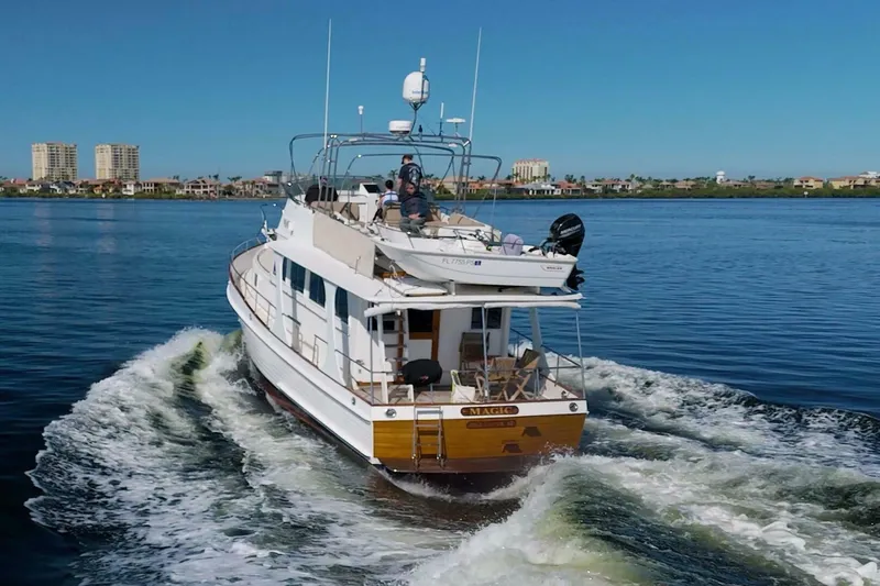 Magic Yacht Photos Pics Grand Banks 46 Europa yacht cruising on calm waters, 1996 model.