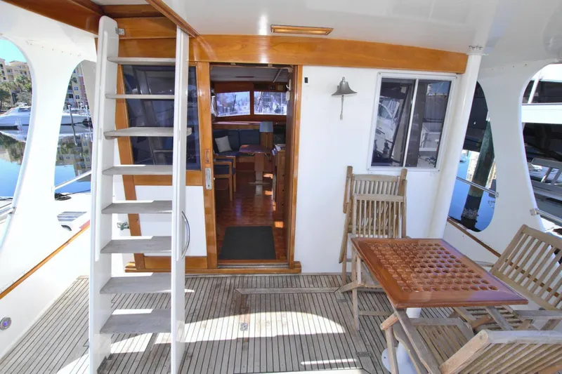 Magic Yacht Photos Pics 1996 Grand Banks 46 Europa yacht interior with wooden deck and seating area.