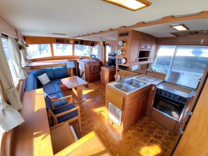 Magic Yacht Photos Pics Interior of 1996 Grand Banks 46 Europa yacht with kitchen and seating area.