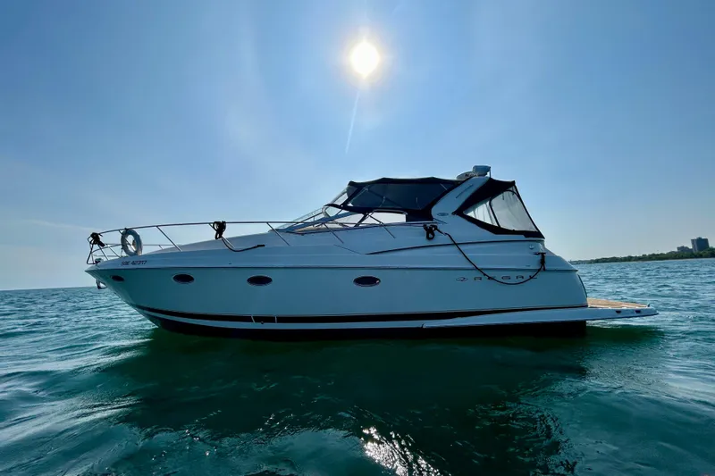 Done Deal Yacht Photos Pics 2002 Regal Commodore 3860 yacht on open water under bright sun.