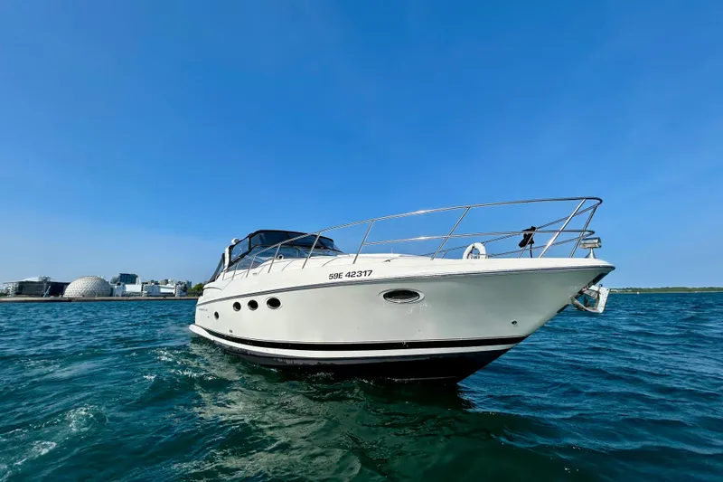 Done Deal Yacht Photos Pics 2002 Regal Commodore 3860 yacht cruising on blue waters under clear sky.