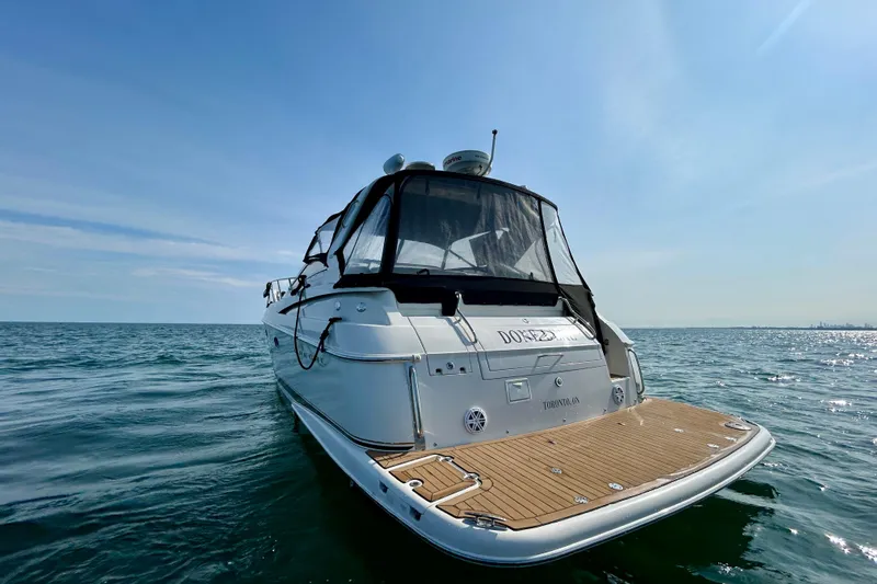 Done Deal Yacht Photos Pics 2002 Regal Commodore 3860 yacht on open water under clear blue sky.