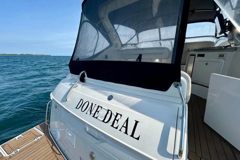 Done Deal Yacht Photos Pics 2002 Regal Commodore 3860 yacht named "Done Deal" on open water.