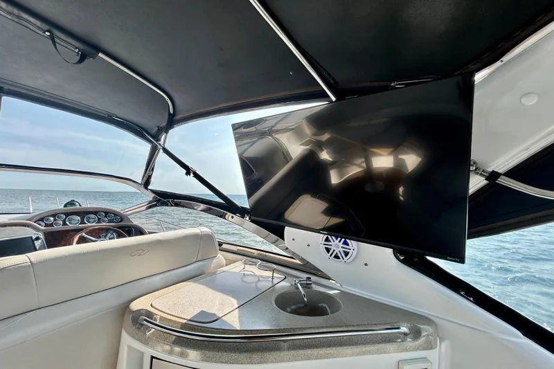 Done Deal Yacht Photos Pics Interior of 2002 Regal Commodore 3860 yacht with TV and ocean view.