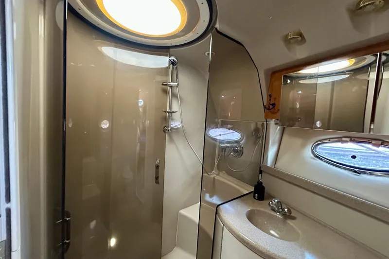 Done Deal Yacht Photos Pics Bathroom interior of 2002 Regal Commodore 3860 yacht with shower and sink.