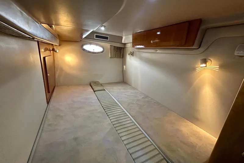 Done Deal Yacht Photos Pics 2002 Regal Commodore 3860 cabin interior with ambient lighting and wood accents.