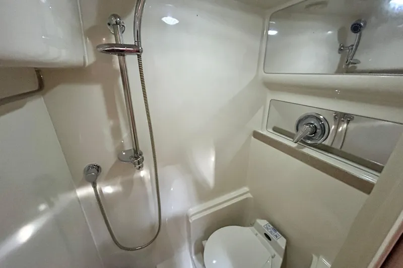 Done Deal Yacht Photos Pics 2002 Regal Commodore 3860 yacht bathroom with shower and toilet.