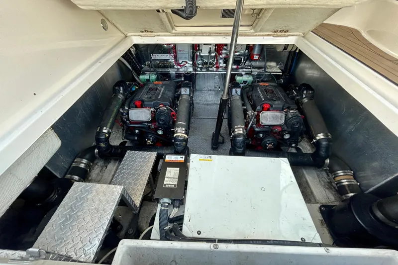 Done Deal Yacht Photos Pics Engine compartment of 2002 Regal Commodore 3860 with dual engines and mechanical components.