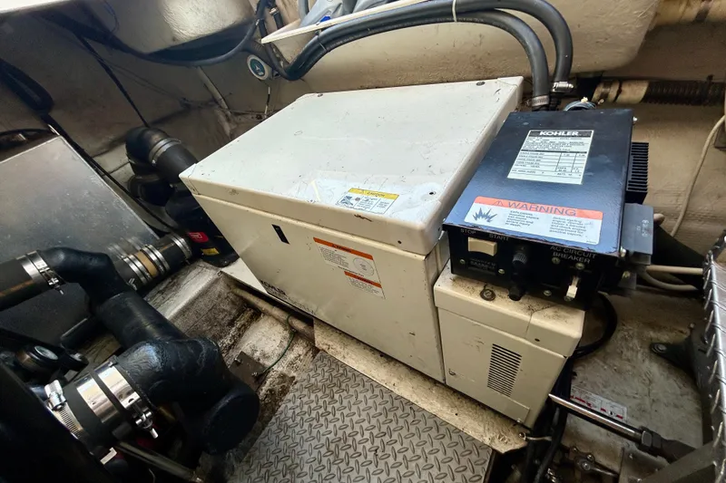 Done Deal Yacht Photos Pics Engine room of 2002 Regal Commodore 3860 with Kohler generator.