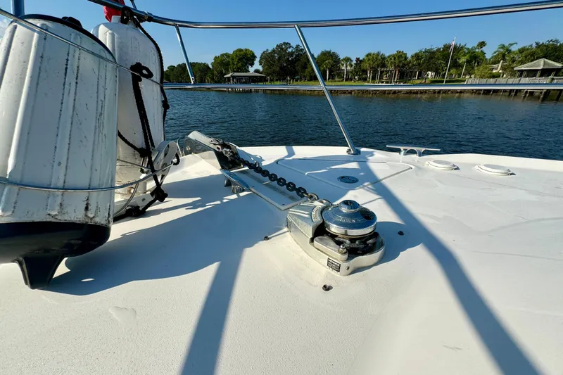 Lighten Up Yacht Photos Pics Bow deck of 2003 Sea Ray 400 Sedan Bridge with anchor winch and fenders.