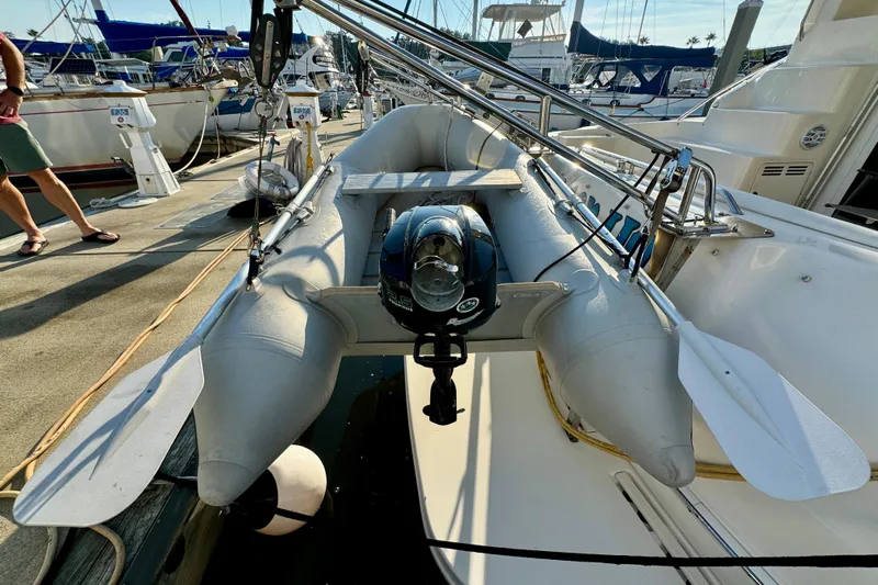 Lighten Up Yacht Photos Pics Inflatable dinghy on 2003 Sea Ray 400 Sedan Bridge yacht, docked at marina.