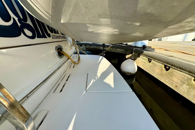 Lighten Up Yacht Photos Pics 2003 Sea Ray 400 Sedan Bridge docked, showing stern details and mooring setup.