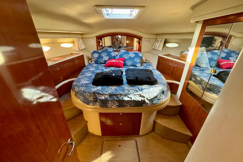 Lighten Up Yacht Photos Pics Luxurious cabin interior of 2003 Sea Ray 400 Sedan Bridge yacht with elegant bedding.