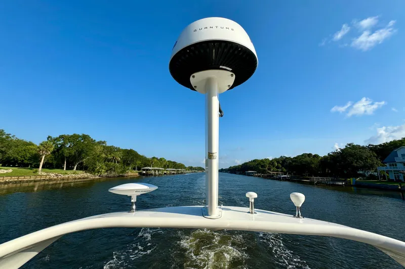 Lighten Up Yacht Photos Pics 2003 Sea Ray 400 Sedan Bridge cruising on a scenic river under a clear blue sky.