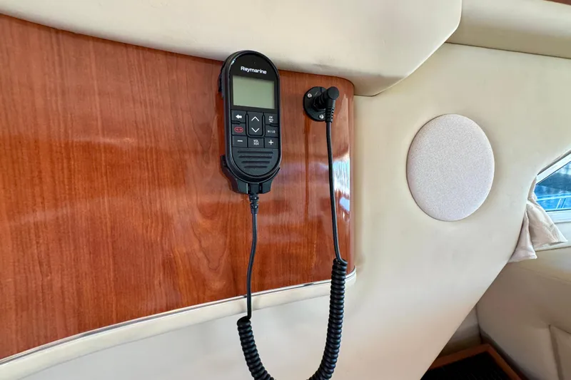 Lighten Up Yacht Photos Pics Raymarine radio on 2003 Sea Ray 400 Sedan Bridge yacht's wooden interior panel.