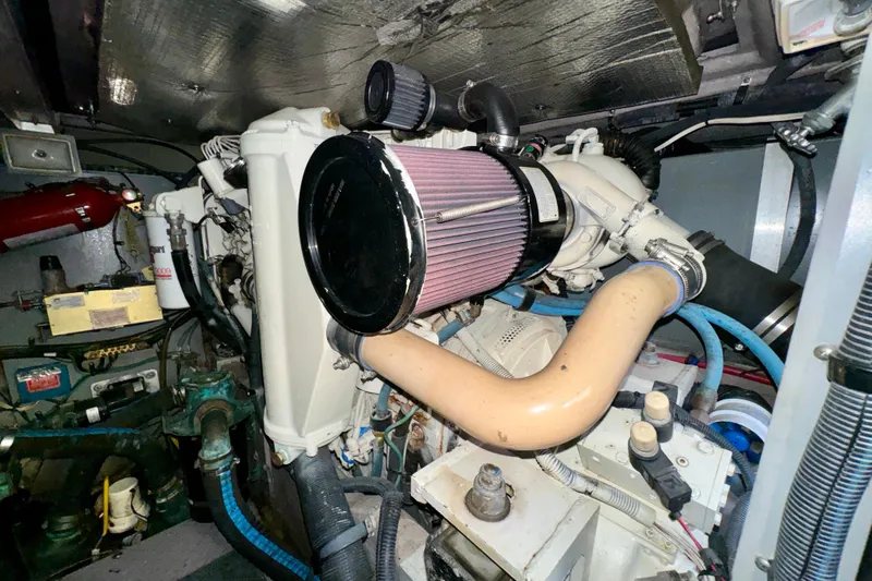 Lighten Up Yacht Photos Pics Engine room of a 2003 Sea Ray 400 Sedan Bridge with visible components and wiring.