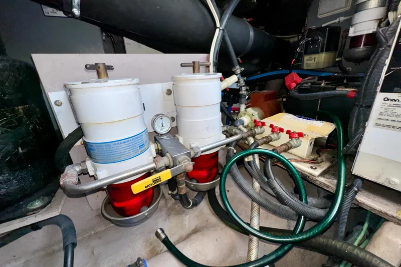 Lighten Up Yacht Photos Pics Engine room of 2003 Sea Ray 400 Sedan Bridge with fuel filters and hoses.