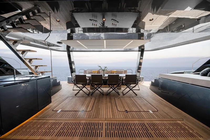 Double Happiness Yacht Photos Pics Luxurious 2024 Sunreef 60 yacht interior with elegant dining area and ocean view.