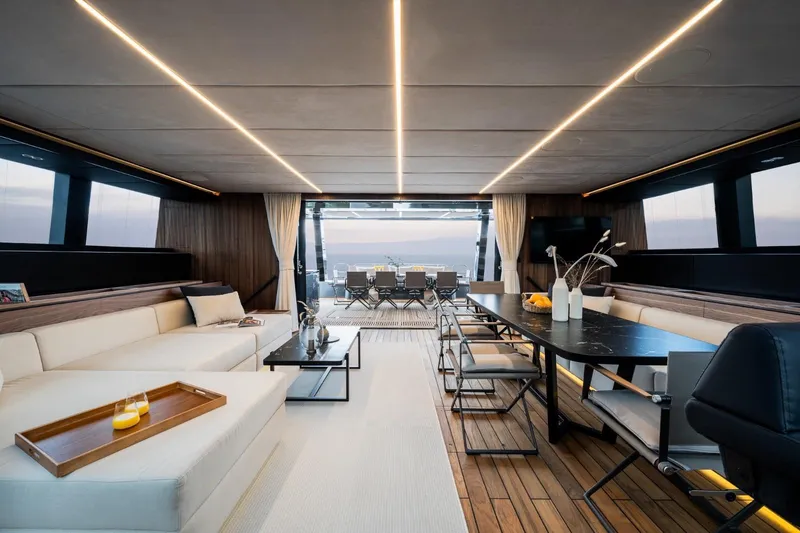 Double Happiness Yacht Photos Pics Luxurious interior of 2024 Sunreef 60 yacht with elegant seating and dining area.