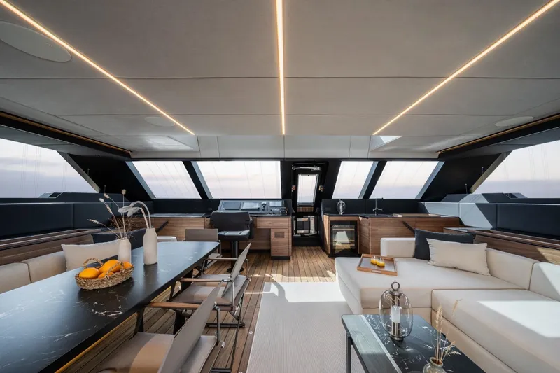 Double Happiness Yacht Photos Pics Luxurious interior of 2024 Sunreef 60 yacht with modern furnishings and panoramic windows.