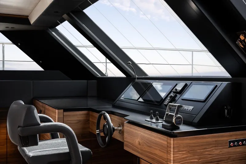 Double Happiness Yacht Photos Pics Luxurious helm of 2024 Sunreef 60 yacht with modern controls and panoramic windows.