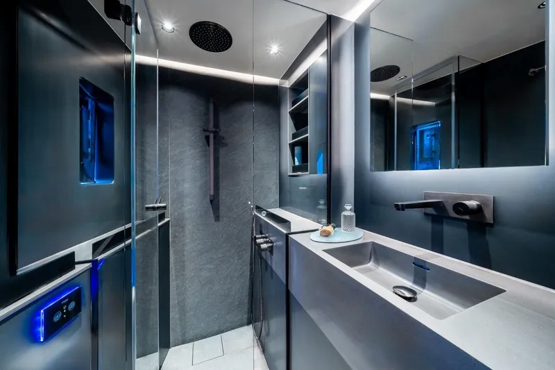 Double Happiness Yacht Photos Pics Luxurious bathroom interior of 2024 Sunreef 60 yacht, featuring modern fixtures and sleek design.