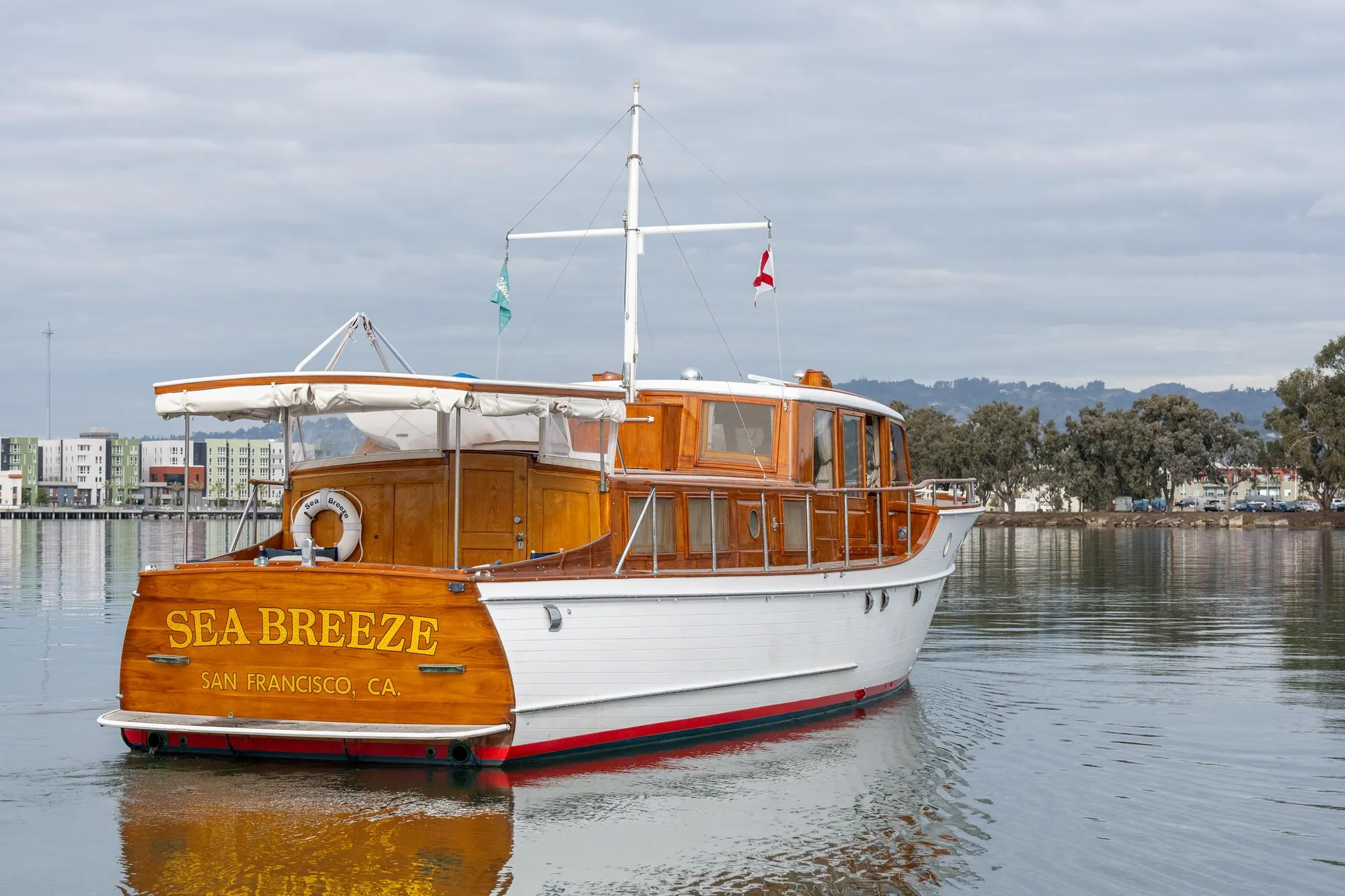 1939 Stephens Brothers Bridgedeck Cruiser "Sea Breeze" on calm water, San Francisco.