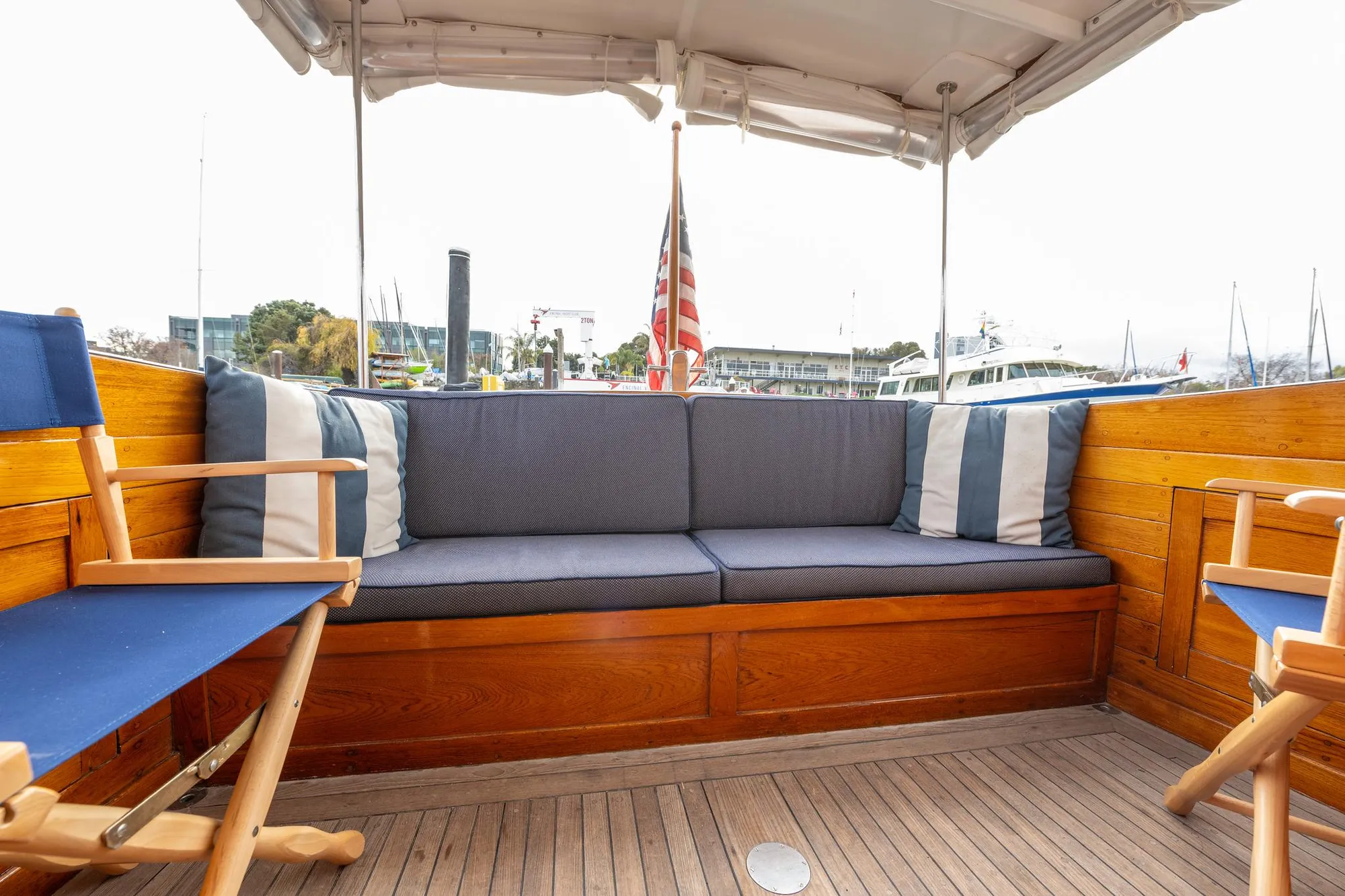 1939 Stephens Brothers Bridgedeck Cruiser interior with wooden seating and nautical decor.