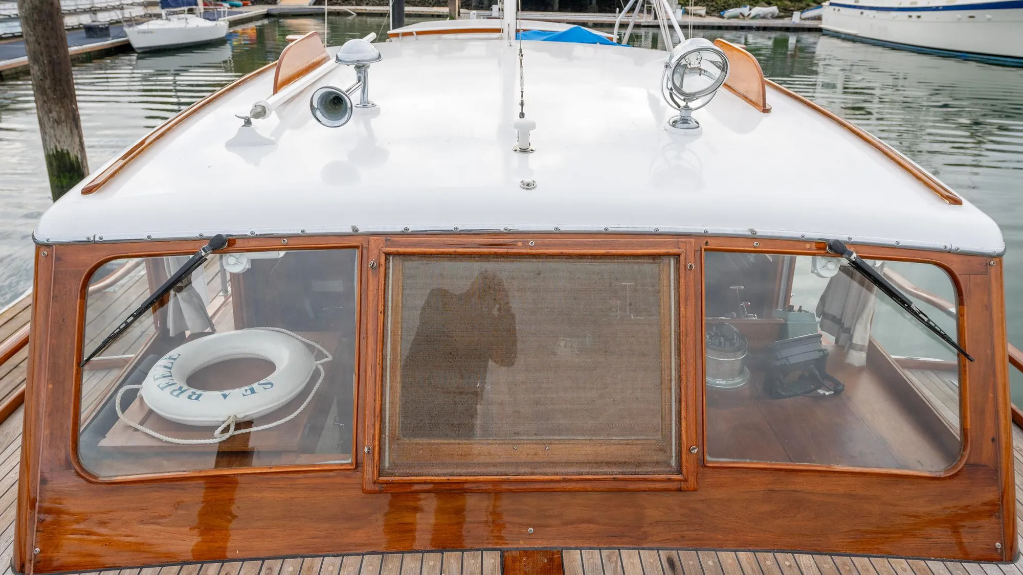1939 Stephens Brothers Bridgedeck Cruiser with wooden details and life preserver on deck.