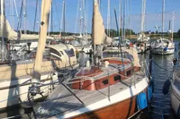 Vintage 1977 Custom Scalar 28 sailboat docked in a marina.